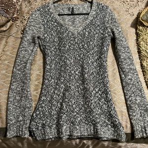 Grey sweater with intertwined sparkly silver